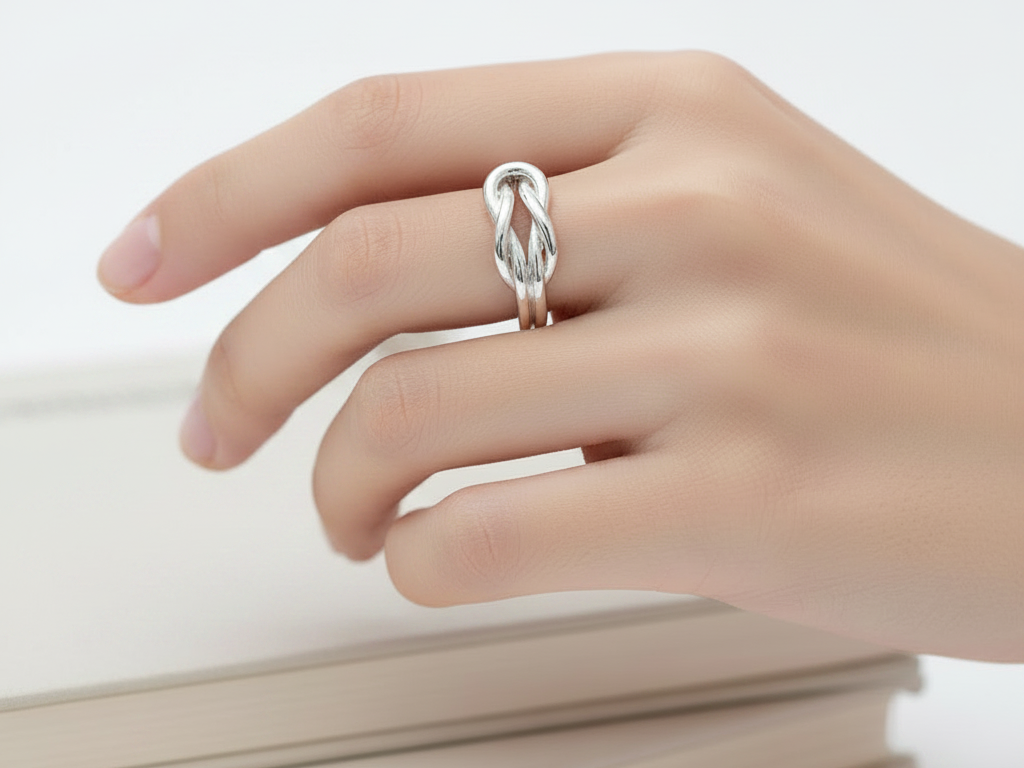 A Silver Infinity Design Ring.