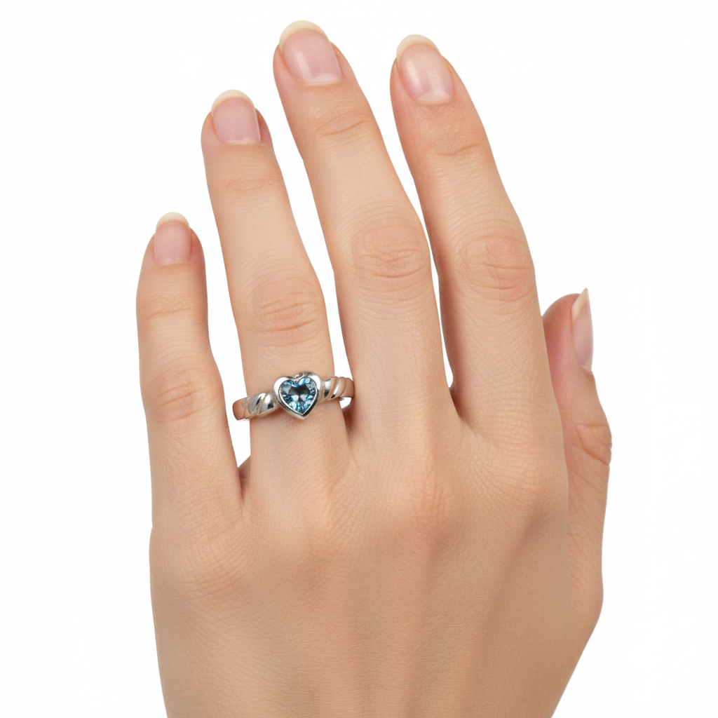 A Kids Aqua Cz Silver Heart Shaped Ring.
