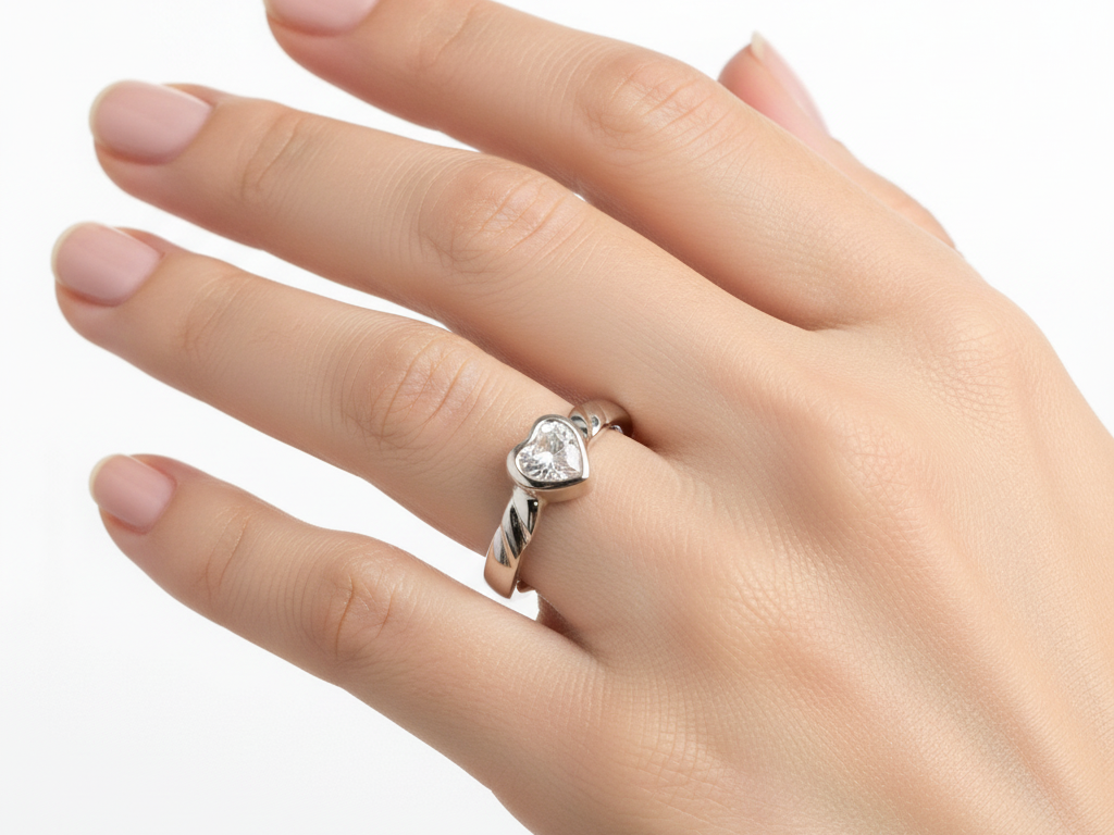 A Kids White Cz Silver Heart Shaped Ring.