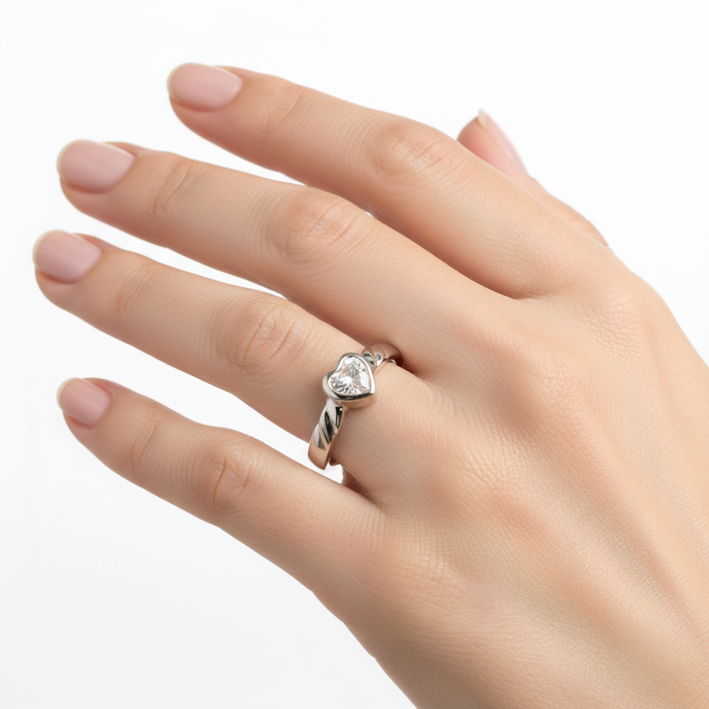A Kids White Cz Silver Heart Shaped Ring.