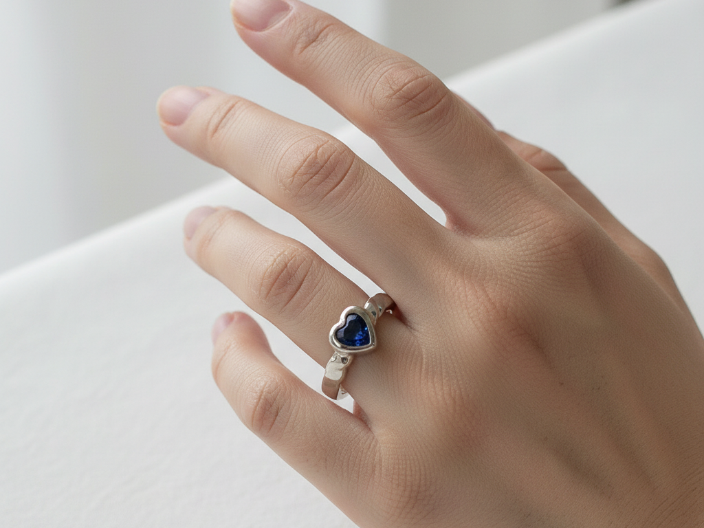 A Kids Sapphire Cz Silver Heart Shaped Ring.