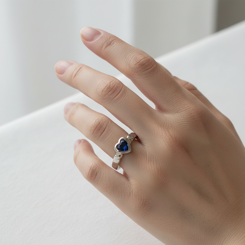 A Kids Sapphire Cz Silver Heart Shaped Ring.