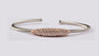A Rose Plated White Cubic Zirconia Stone Set Silver Bangle.