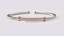 A Rose Plated White Cubic Zirconia Stone Set Silver Bangle.