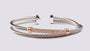 A Rose Plated White Cubic Zirconia Stone Set Silver Bangle.