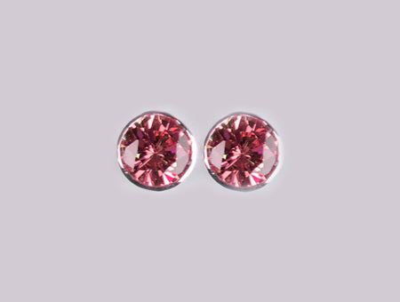 A Pink Cubic Zirconia Earring.