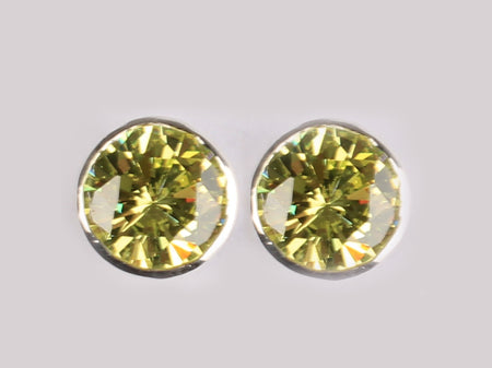 A Peridot & White Cubic Zirconia Earring.