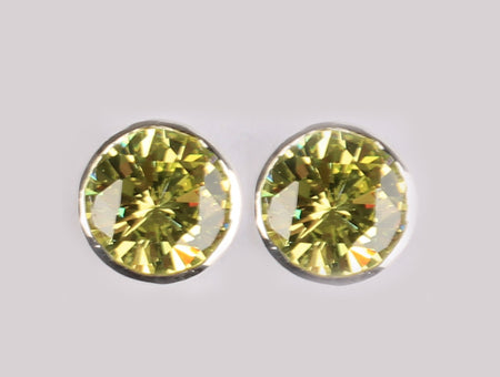 A Peridot & White Cubic Zirconia Earring.