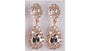 A Silver with Rose Gold Plate Earring.