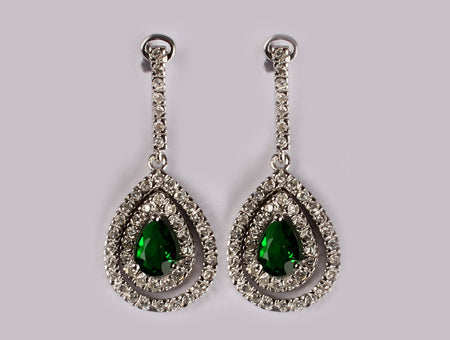 A Emerald & White Cubic Zirconia Earring.