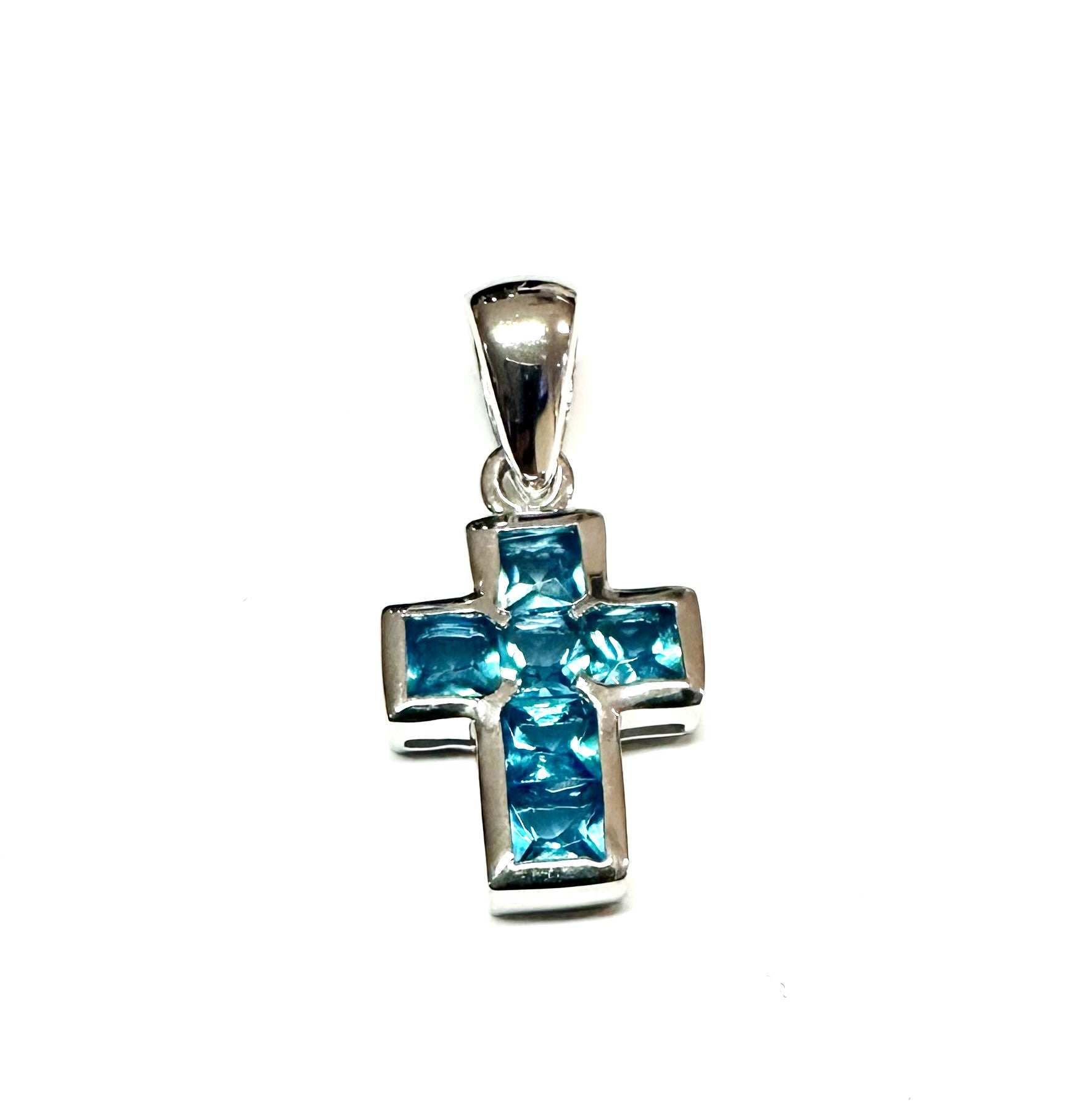 A Aquamarine & White Cubic Zirconia Cross Pendant.