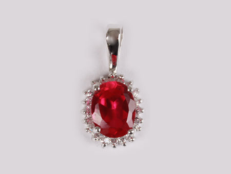 A Ruby & White Cubic Zirconia Pendant.