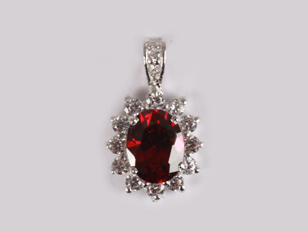 A Garnet & White Cubic Zirconia Pendant.