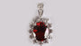 A Garnet & White Cubic Zirconia Pendant.