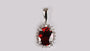 A Garnet & White Cubic Zirconia Pendant.