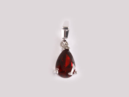 A Garnet & White Cubic Zirconia Pendant.