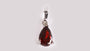 A Garnet & White Cubic Zirconia Pendant.