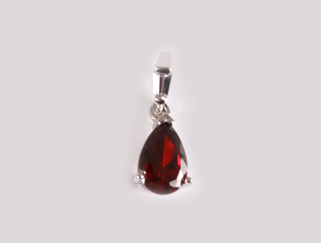 A Garnet & White Cubic Zirconia Pendant.