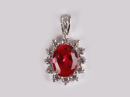 A Ruby & White Cubic Zirconia Pendant.