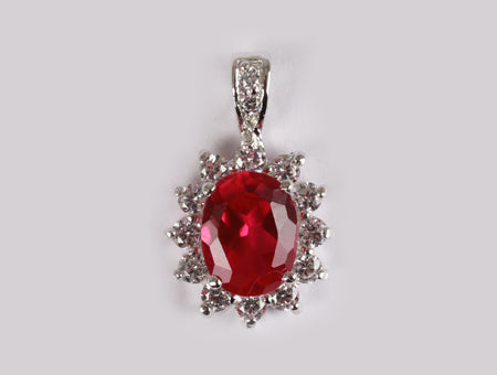 A Ruby & White Cubic Zirconia Pendant.