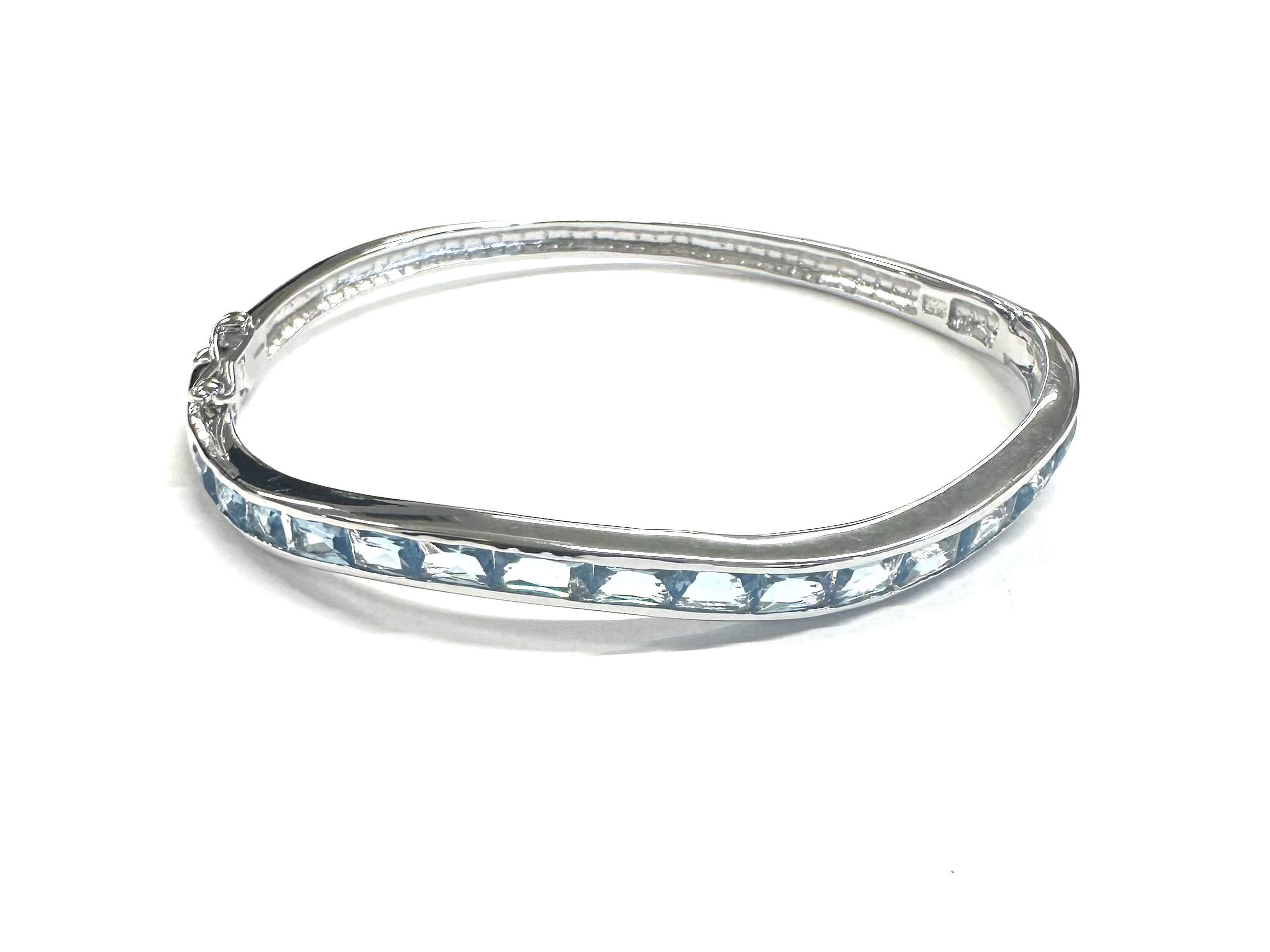Aquamarine Cubic Zirconia Silver Twist Design Bangle.