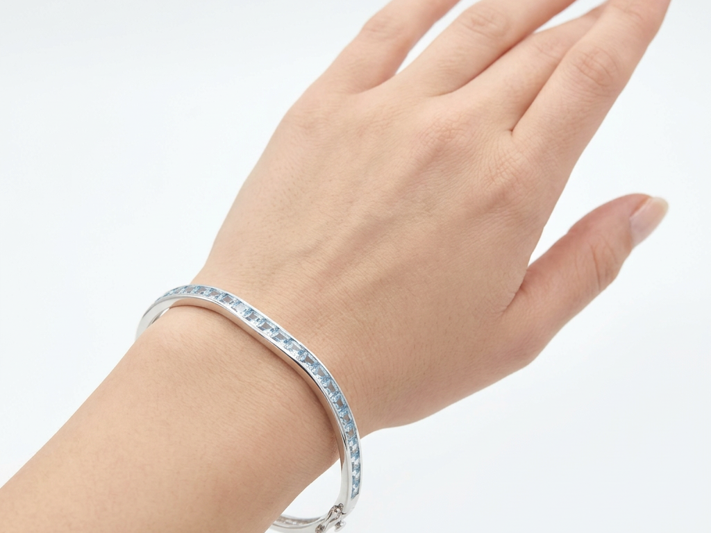 Aquamarine Cubic Zirconia Silver Twist Design Bangle.