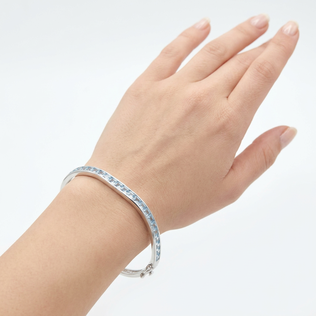 Aquamarine Cubic Zirconia Silver Twist Design Bangle.