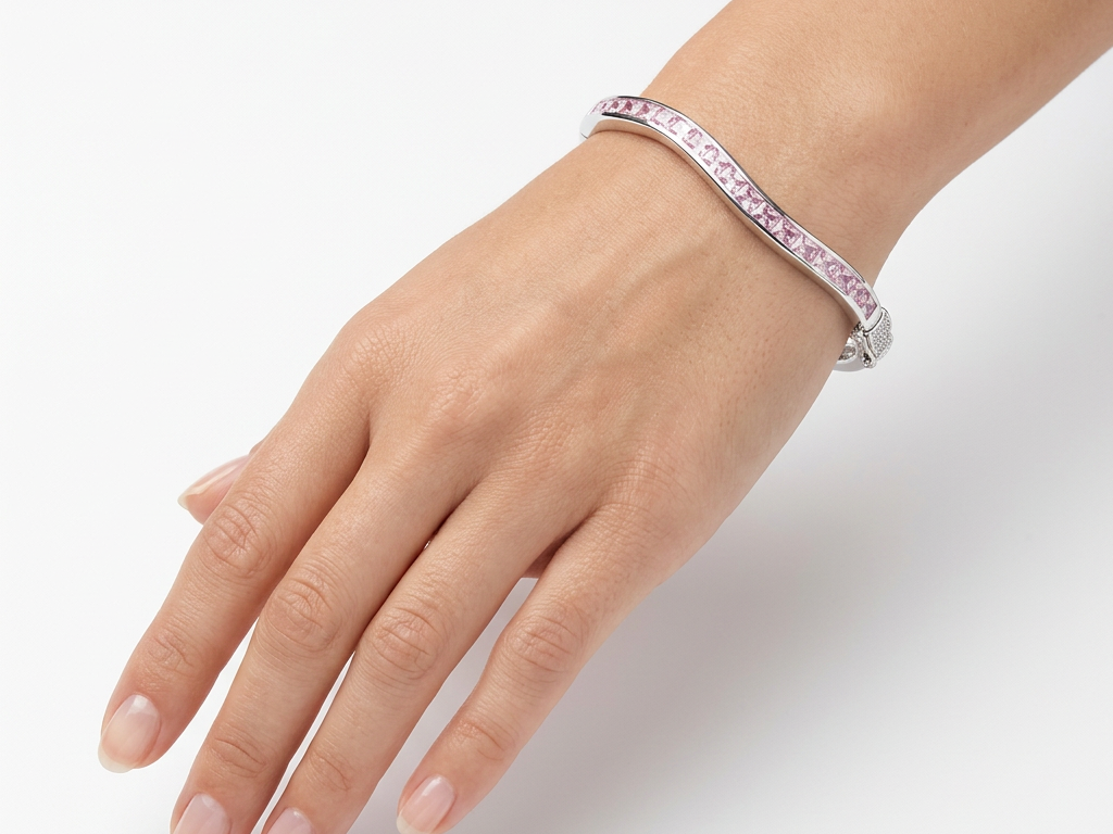 Pink Cubic Zirconia Silver Twist Design Bangle.