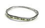 Peridot Dark And Light Cubic Zirconia Silver Twist Design Bangle.
