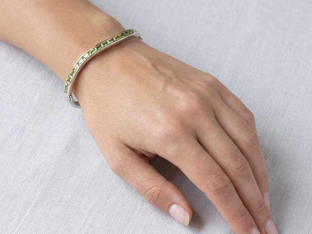 Peridot Dark And Light Cubic Zirconia Silver Twist Design Bangle.