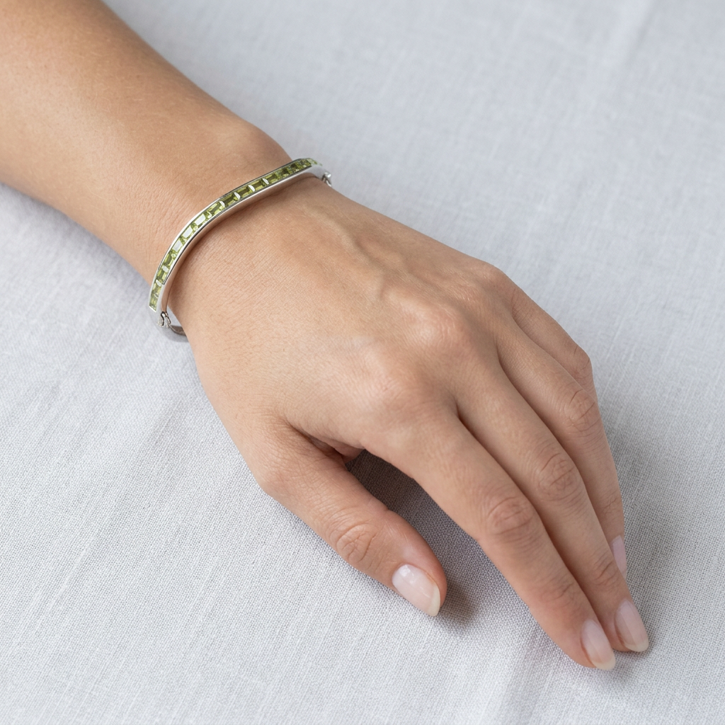 Peridot Dark And Light Cubic Zirconia Silver Twist Design Bangle.