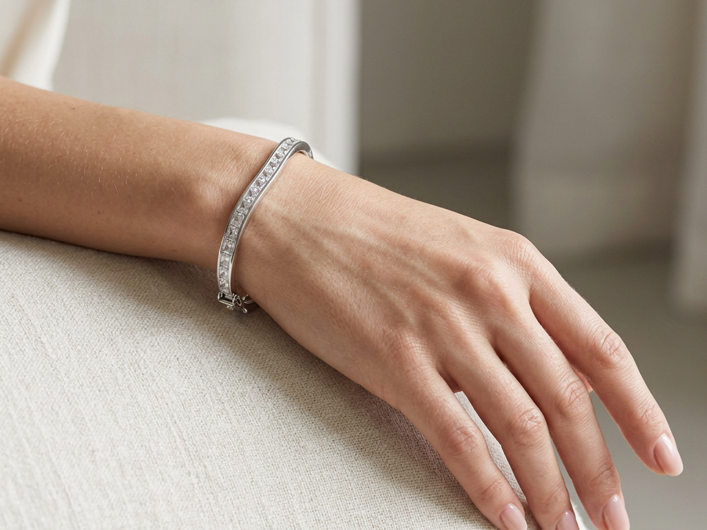 White Cubic Zirconia Silver Twist Design Bangle.