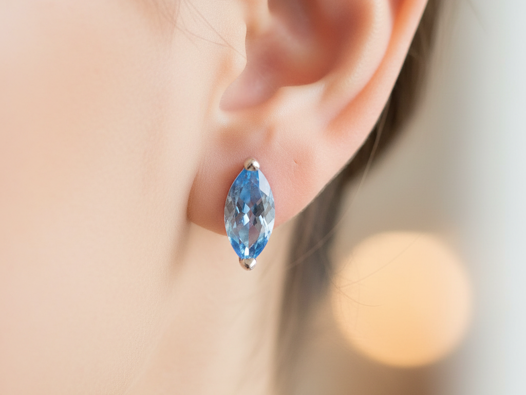 An Aquamarine Cubic Zirconia Earring.