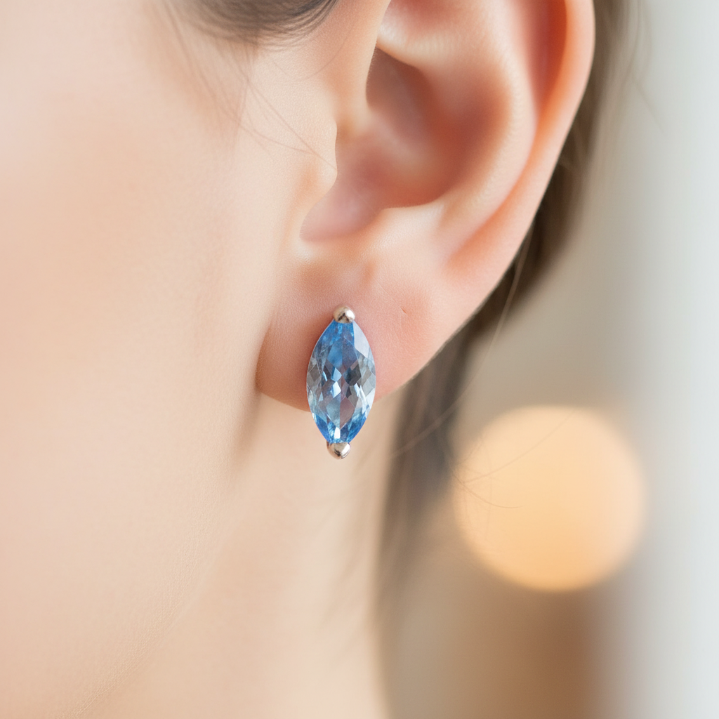 An Aquamarine Cubic Zirconia Earring.