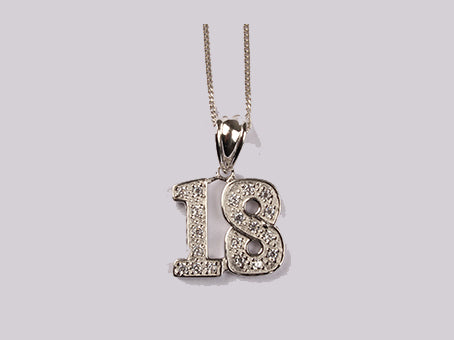 A White Cubic Zirconia Pendant With Chain.