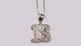 A White Cubic Zirconia Pendant With Chain.