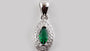A Emerald & White Cubic Zirconia Pendant.