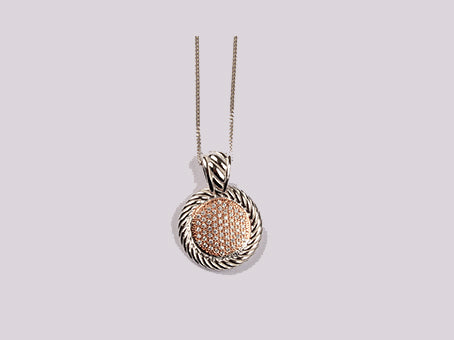 A Silver with Rose Gold Plate Pendant.