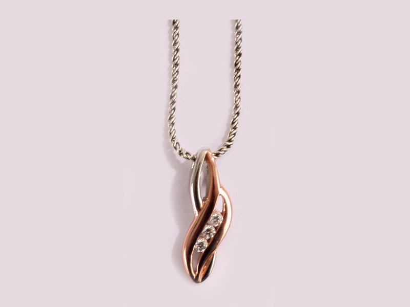 A Silver with Rose Gold Plate Pendant