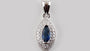 A Sapphire & White Cubic Zirconia Pendant.