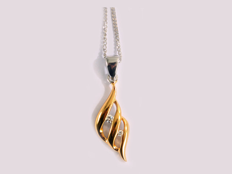 A Silver With Yellow Gold Plate Pendant Chained