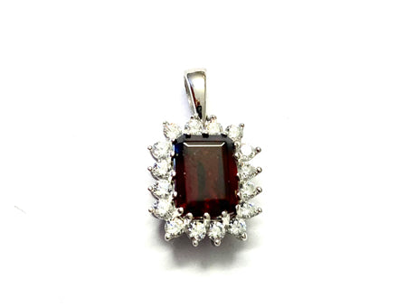 9 CT White Gold Garnet Earring.