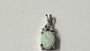 9 CT White Gold Opal And White Cz Pendant