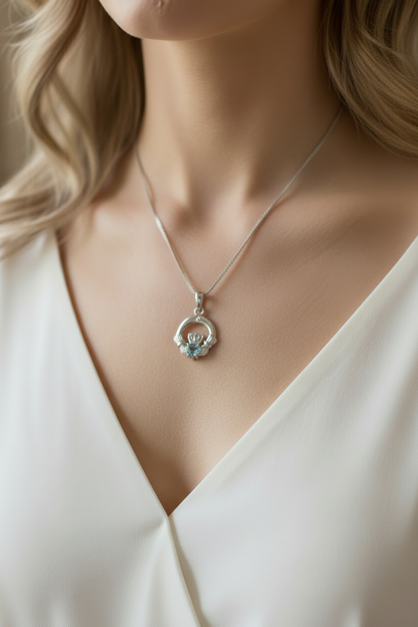 9CT White Gold Aqua Birthstone Claddagh Pendant.