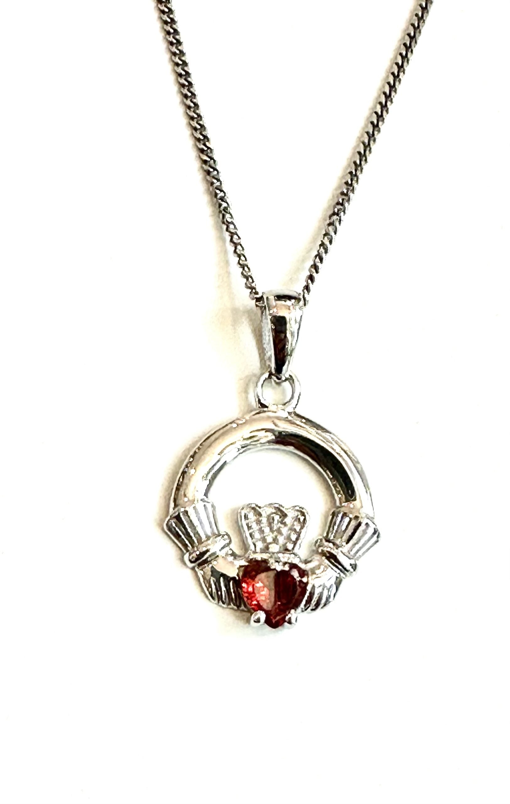 9CT White Gold Garnet Birthstone Claddagh Pendant.