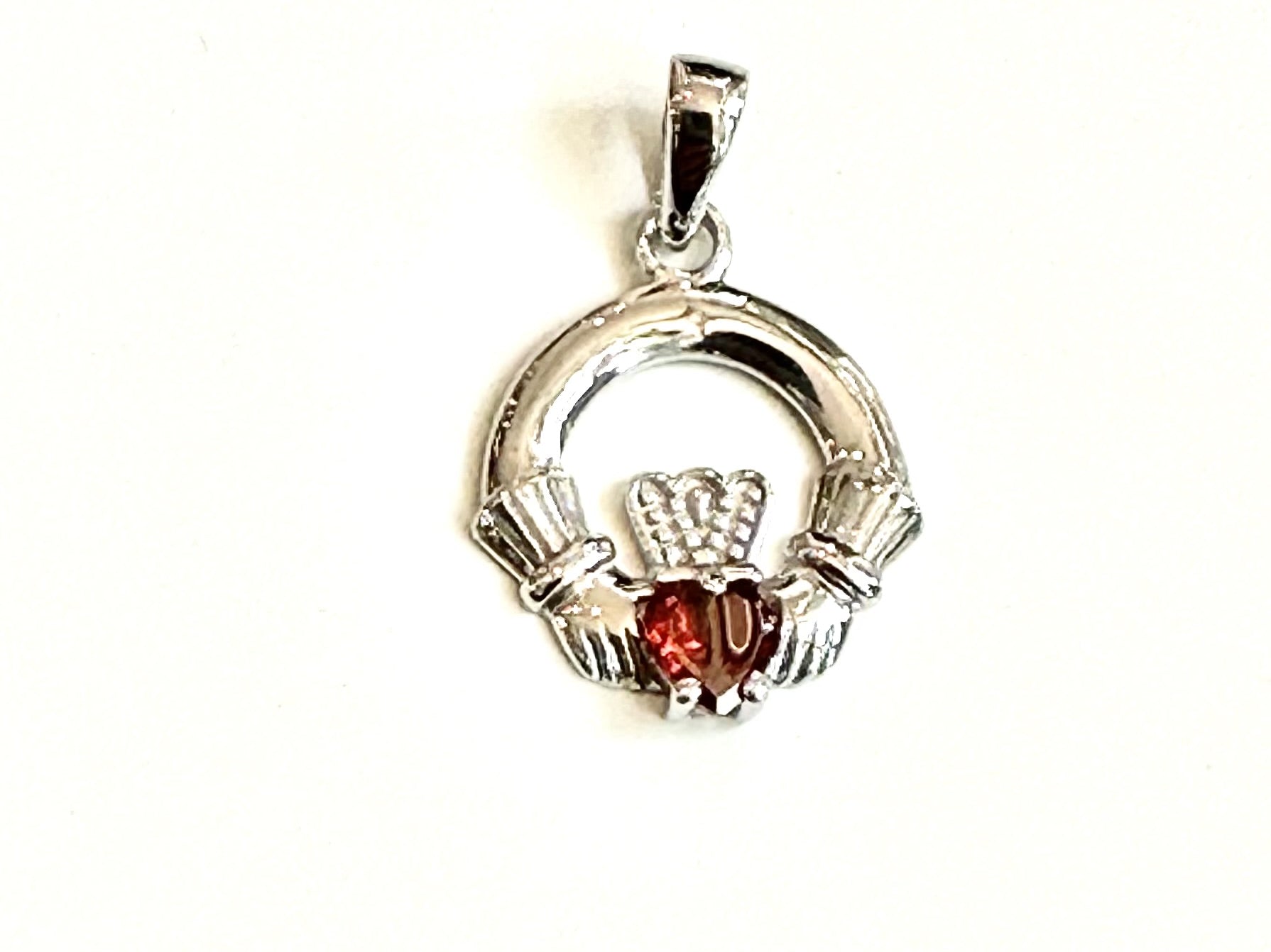 9CT White Gold Garnet Birthstone Claddagh Pendant.