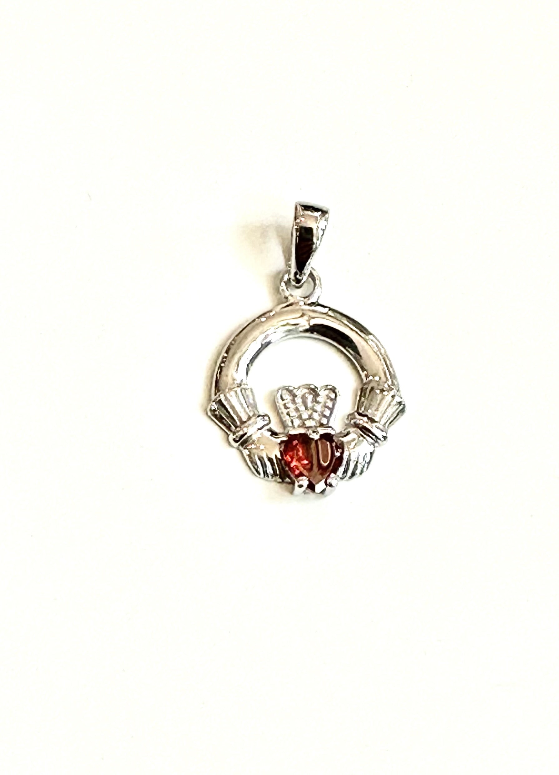 9CT White Gold Garnet Birthstone Claddagh Pendant.