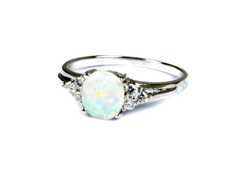 A Opal And White Cubic Zirconia Ring
