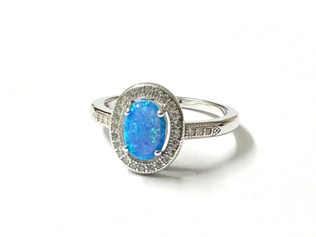 A Blue Opal And White Cubic Zirconia Ring