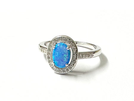 A Blue Opal And White Cubic Zirconia Ring